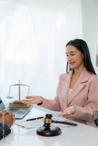 Legal genius female lawyer working with laptop in law office, judge hammer with justice, justice concept