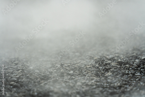 gravel texture floor with mist or fog. Light, dark and gray abstract gravel texture for display products