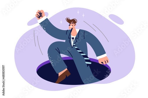 Business man jumps out of hole after fall, demonstrating unwillingness to give up