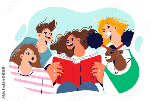 Happy children read book standing around classmate with encyclopedia and are surprised open mouths