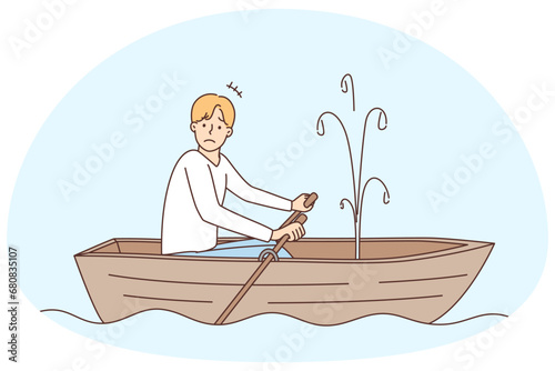 Stressed man sailing in boat with leakage