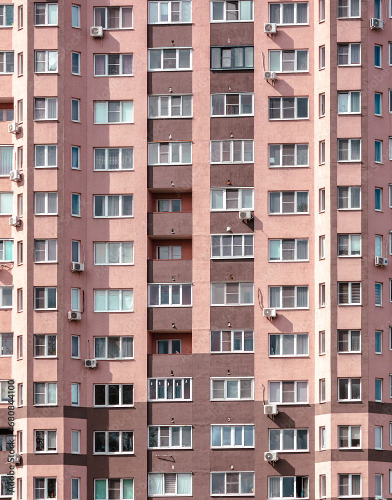 Walls with windows of a multi-story building as a background