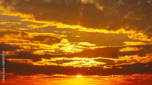Golden sunset on the sky with clouds