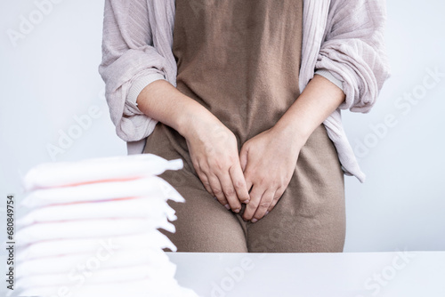 woman suffering from vaginal pain during period, vulvar discomfort, itching, symptom of menstruation concept photo