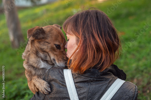 Canvas Print Young woman walking her mongrel dog