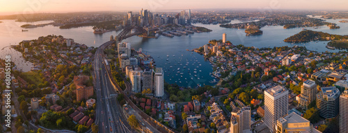 Panoramic aerial view of Sydney City, Sydney Harbour and the Harbour Bridge, NSW Australia on a sunny early morning in November 2023 