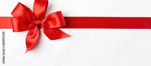 Red ribbon with bow and stars copy space on white background. AI generated image