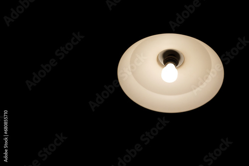 light bulb on black background, Light lamp bulb hanging on the ceiling in the dark room