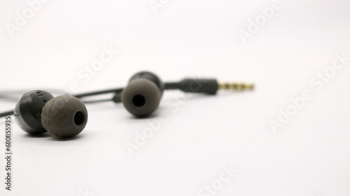 Close up of black wired earphones