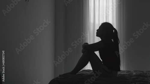 Silhouette of a woman with symptoms of depression and depression, Sadness, Anxiety, Family Problems, Mentally ill Person, Domestic Violence photo