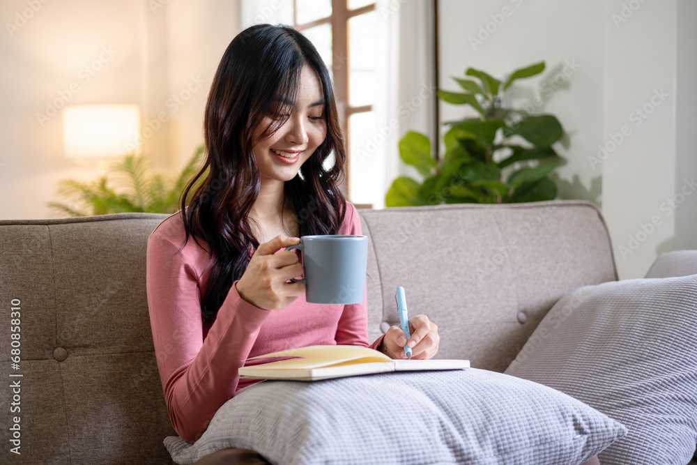 Woman spend time at home seated on sofa Woman spend time at home seated on sofa