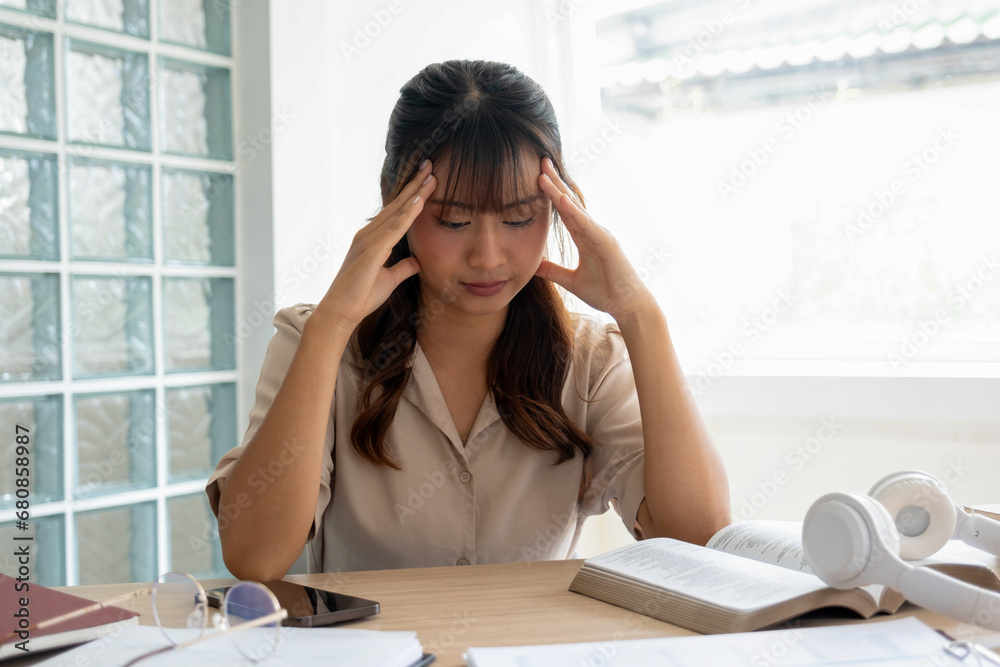 Young woman stressed while online study or project work. Young woman stressed while online study or project work.