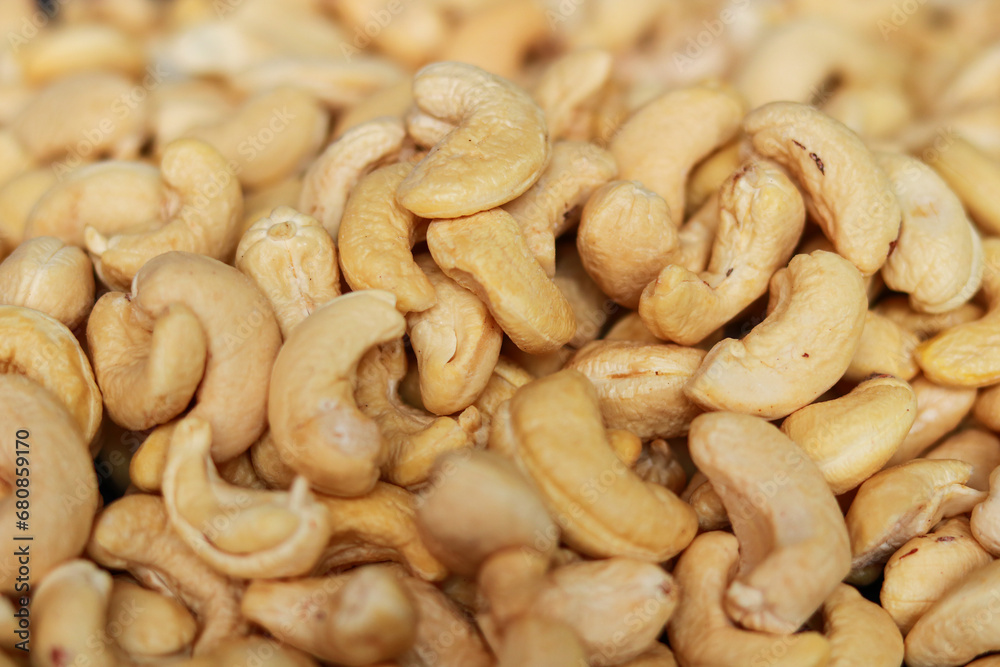 Close-up of cashew nuts background. Healthy food and nutrition concept. Close-up of cashew nuts background. Healthy food and nutrition concept.