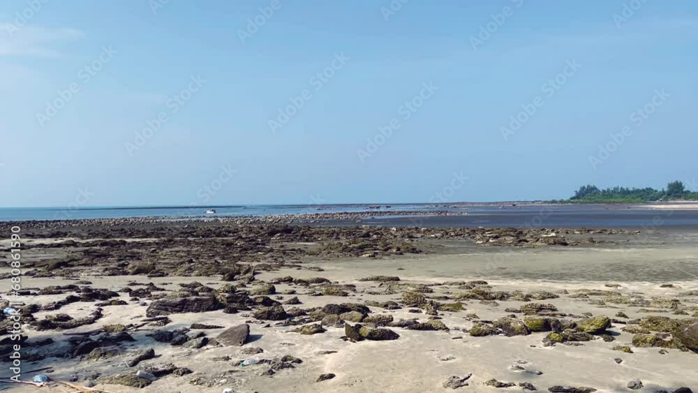 Majestic view at sea. Waves at rocky shore in the evening.