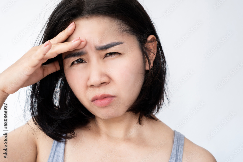 light sensitivity , photophobia, eye blurry concept with Asian woman forcing to watch or difficult to read light sensitivity , photophobia, eye blurry concept with Asian woman forcing to watch or difficult to read