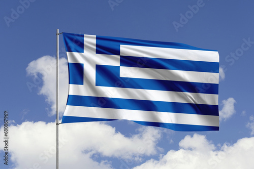 Greece flag fluttering in the wind on sky.