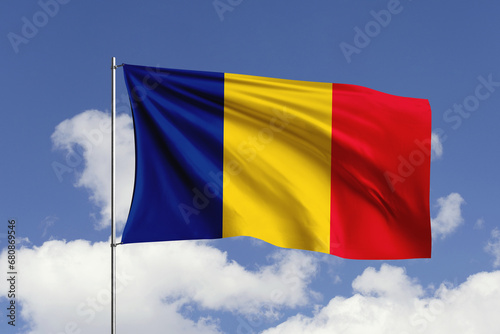 Romania flag fluttering in the wind on sky.