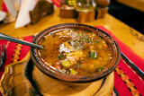 A steaming bowl of hearty Balkan soup, a savory delight in Bulgarian cuisine.