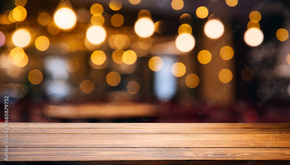 Empty wooden table and blurred background of bar or cafe. For product showing