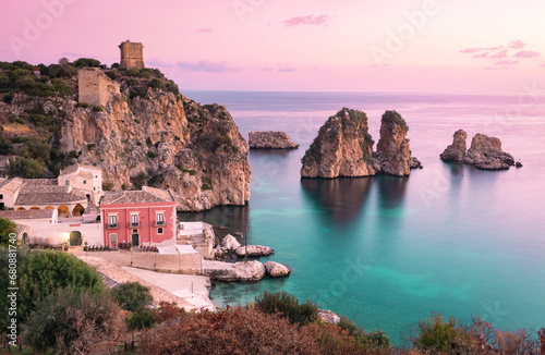 Italy, Sicily, Scopello, Coastal village and Tonnara di Scopello stack rocks at dusk photo