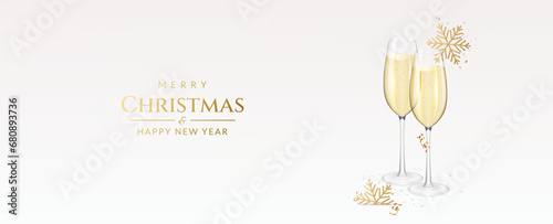 Christmas and New Year greeting card with transparent realistic two glasses of champagne with ribbons, snowflakes and confetti.