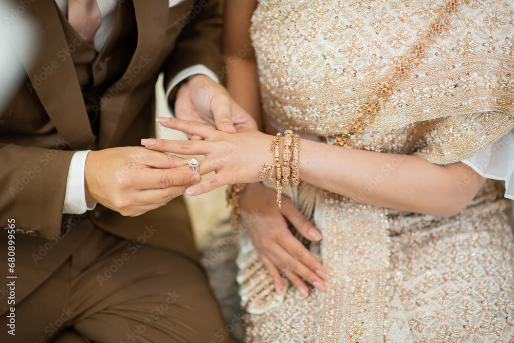 Fototapeta premium wear a ring, wedding ring, love couple