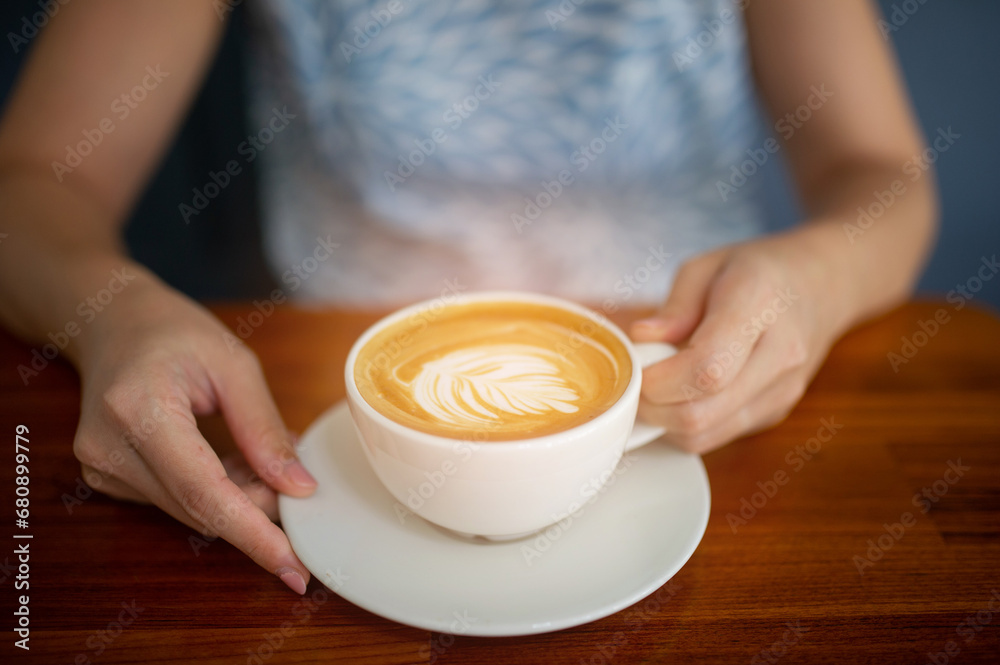 closeup hand drinking hot coffee, relax time closeup hand drinking hot coffee, relax time