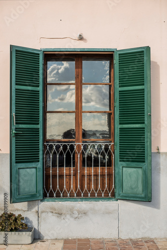 Window of house with green shutters