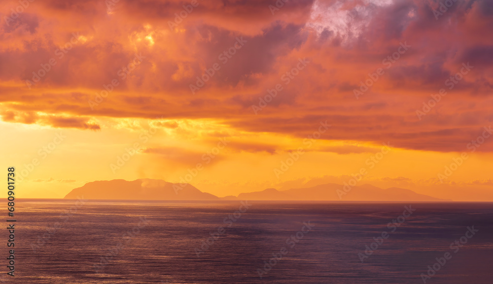 view at sunrise or sunset in sea with nice beach , surf , calm water and beautiful clouds on a background of a sea landscape