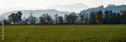 Fotografie Layered Farmland, Trees, Mountains at sunset during Fall in Willamette Valley,