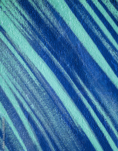 Colorful abstract brush strip drawing on the walls of the city. Striped pattern for wallpaper design. Beautiful bright colorful street art graffiti background.