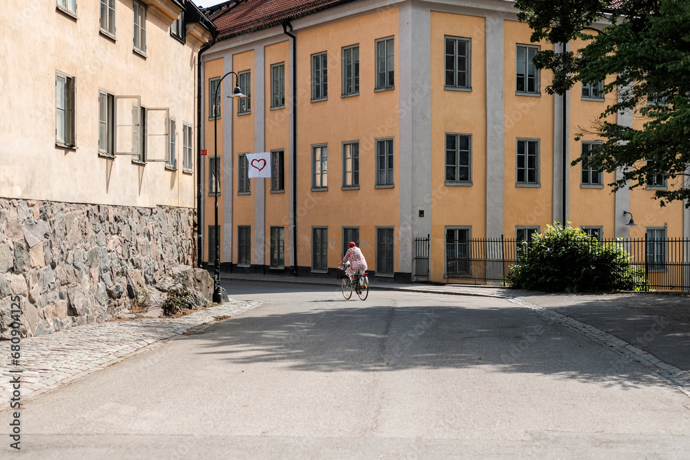 Woman riding bicycle on street Woman riding bicycle on street