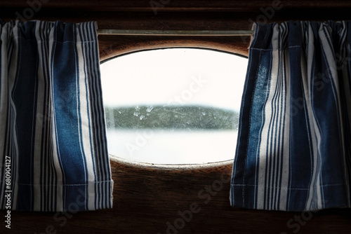 Window and curtains on boat photo