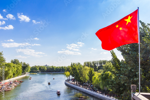 Chinese national flag at the Qianhai lake in Beijing, China photo