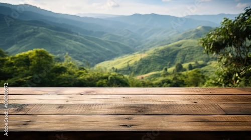 Wooden Table with Blur Tea Plantation Background © Jiraphiphat