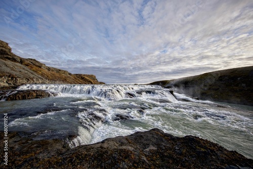 Scenic view of a river flowing through a barren landscape in Iceland