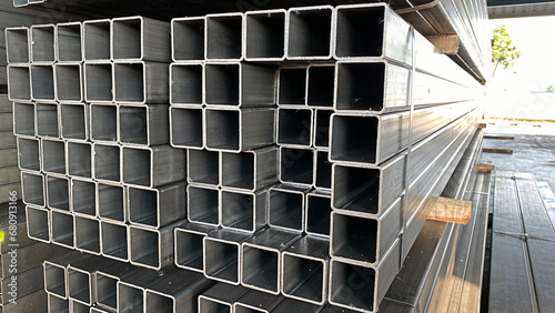 Tableau sur toile Metal profile pipe of rectangular cross section in packs at the warehouse of met