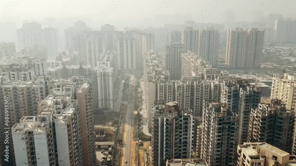 Aerial view of Greater Noida City in Uttar Pradesh, India. Construction of a multi-story Residence apartment building. Drone shot of modern City high-rise skyscraper buildings in India. Aerial view of Greater Noida City in Uttar Pradesh, India. Construction of a multi-story Residence apartment building. Drone shot of modern City high-rise skyscraper buildings in India.