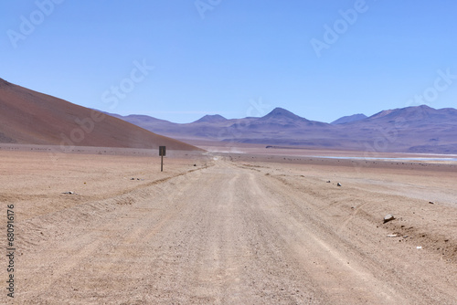 Bolivia  Salvador Dali Desert. Avoroa Nationa Park   A road leading through the desert towards the mountains.