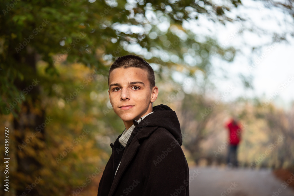 a 16-year-old teenager poses outside a 16-year-old teenager poses outside