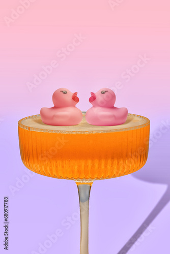 Fotografie Pink Rubber Ducks Swimming in Bubbly Cocktail - Unique Idea for Baby Shower or V