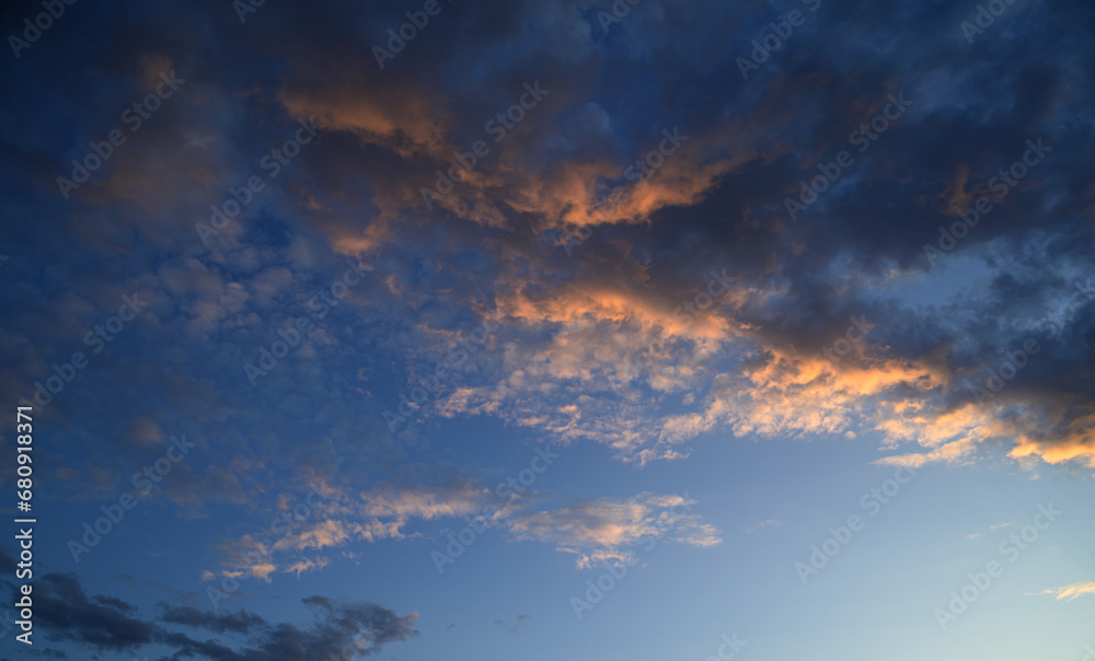 Obraz premium Sunset sky with orange clouds. Nature background.