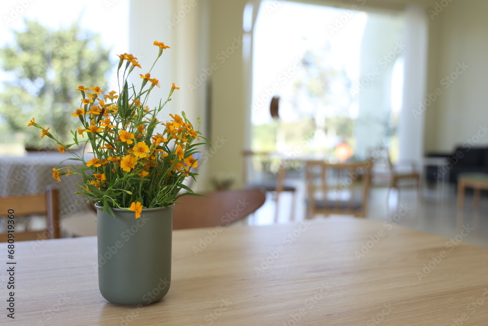 yellow flower in coffee cafe 