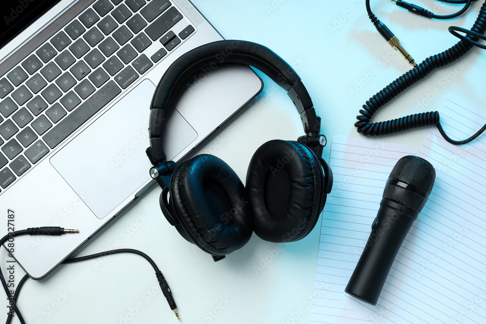 Big headphones, on a table with a laptop. Big headphones, on a table with a laptop.