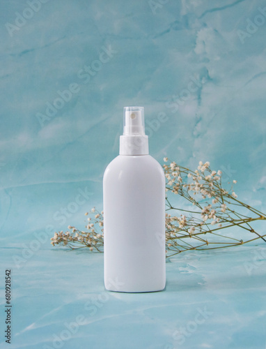 White cosmetic spray bottle mockup on marble background. © Олена Смерічка