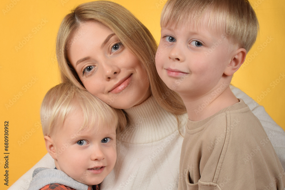 happy mother hugs her little sons happy mother hugs her little sons