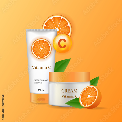 Cream with vitamin C in a glossy tube next to sliced oranges and leaves. A container of a cosmetic product for skin care, makeup and the concept of female beauty.