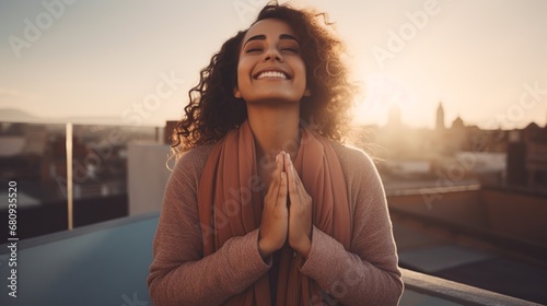 Woman Praying in Sunlight with Closed Eyes and Clasped Hands