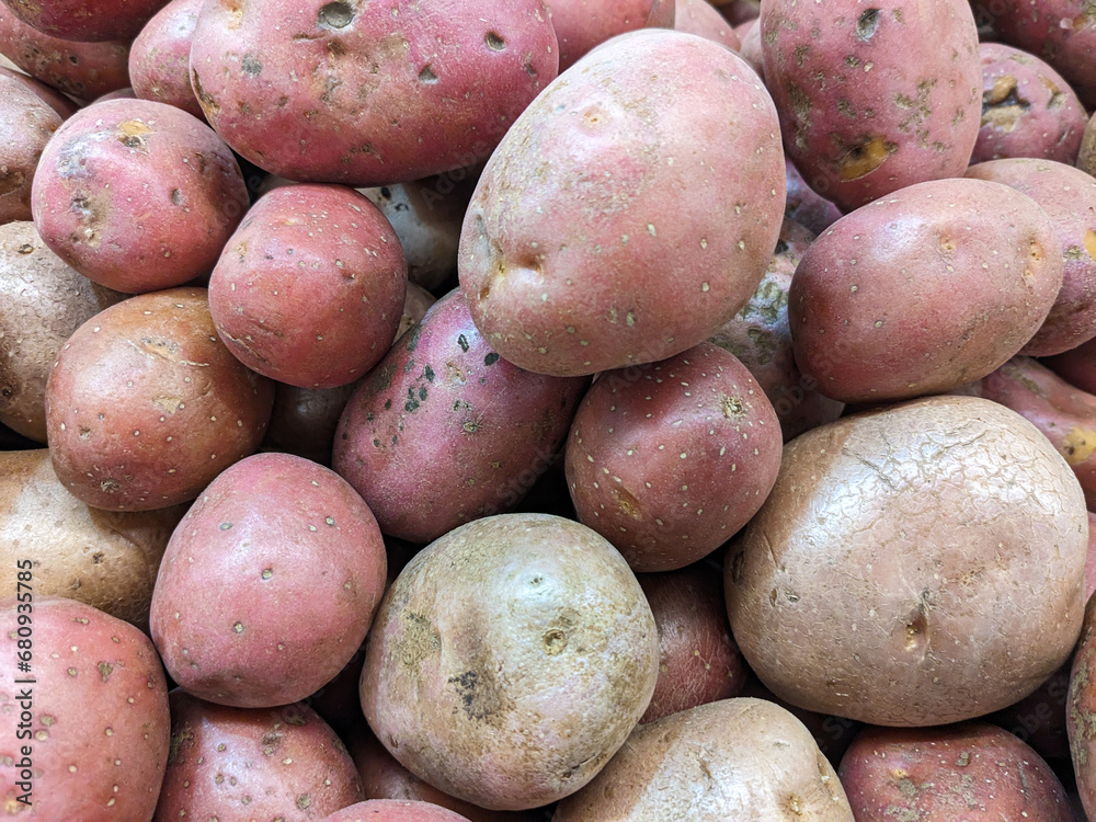 Background of red or pink potatoes top view. Background of red or pink potatoes top view.
