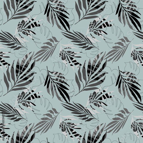 Seamless pattern of tropical palm and monstera leaves.